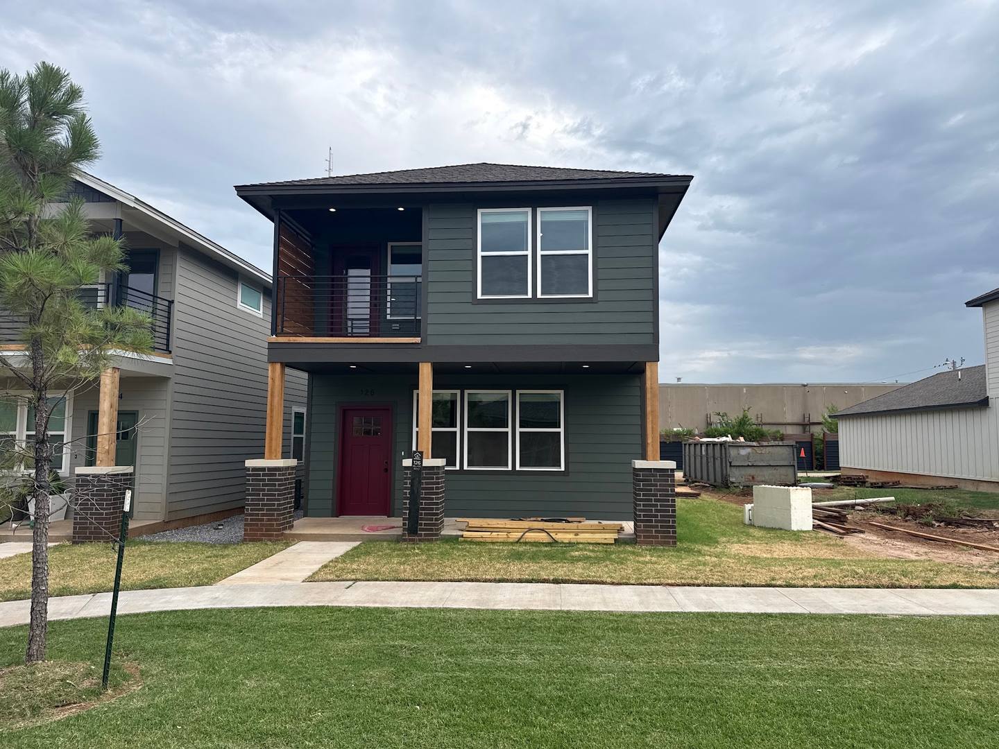 Two-story home with a green front lawn